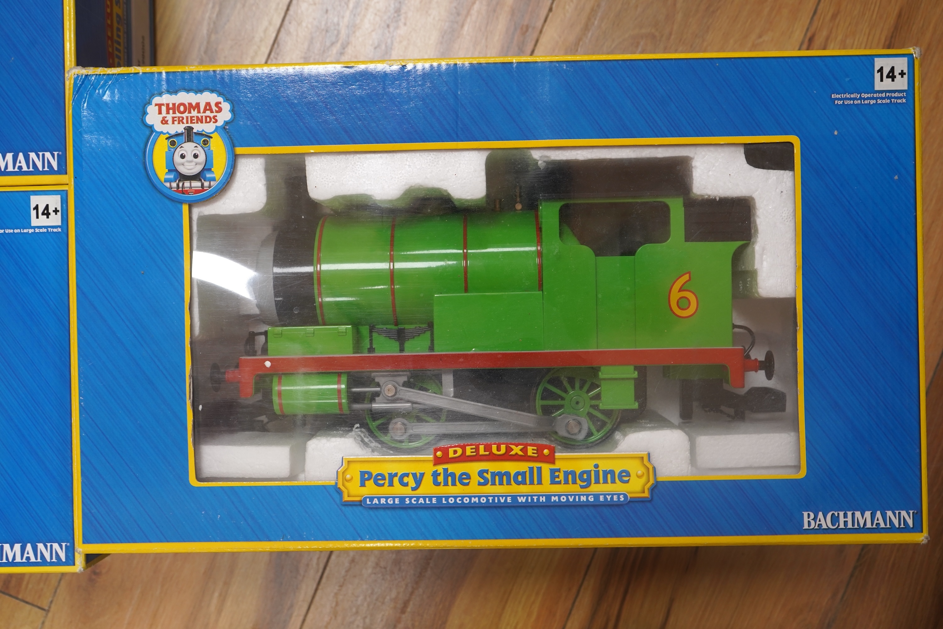 Three boxed Bachmann G gauge (45mm gauge) Thomas the Tank Engine items; Percy the Small Engine (91402), a Cargo Car (98006) and a Troublesome Truck (98001). Condition - good.
